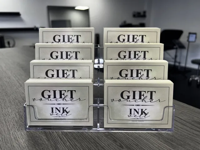 A stand of Inkwell gift voucher cards on the studio counter