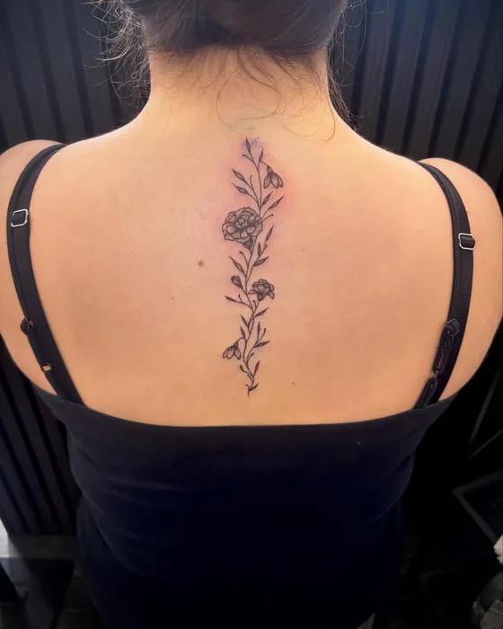 Floral spine, tattooed by Lucy at Inkwell Tattoo Studio, Blaydon
