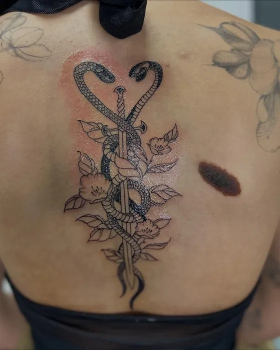 Sword & serpents spine, tattooed by Tabitha at Inkwell Tattoo Studio, Blaydon